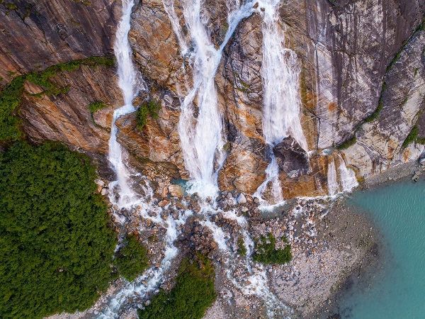 Alaska-Tracy Arm-Fords Terror Wilderness-Waterfall flowing down cliff side along Endicott Arm